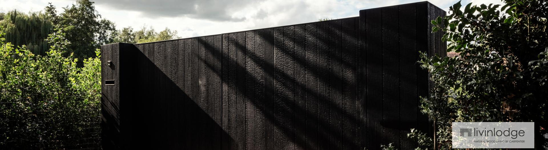 Wooden swing gate in charred ash