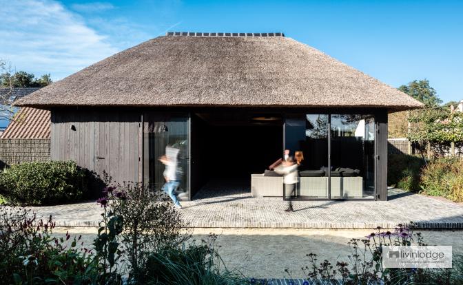 Pool house with thatched roof and thermal ash cladding, De Haan