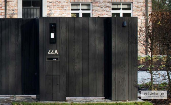 Wooden sliding gate with black finish