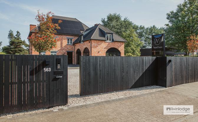Modern wooden sliding gate and matching fencing