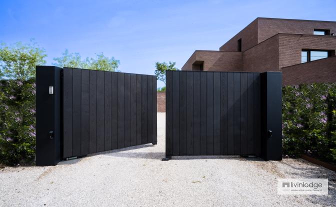 Wooden swing gate, finished in black