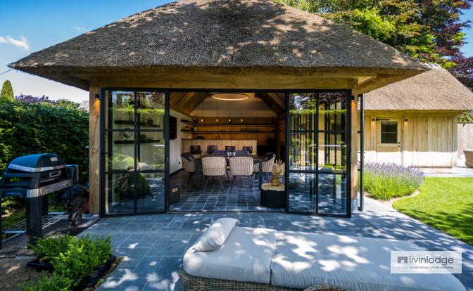 Classic oak pool house with tatched roof