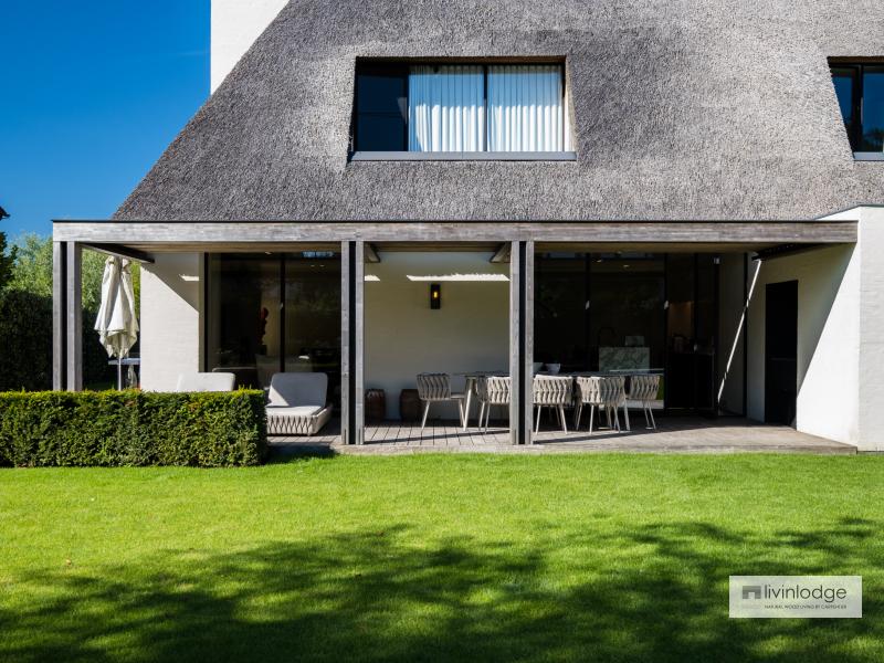 A stylish pergola with a louvered roof on an extension offering comfort all year round