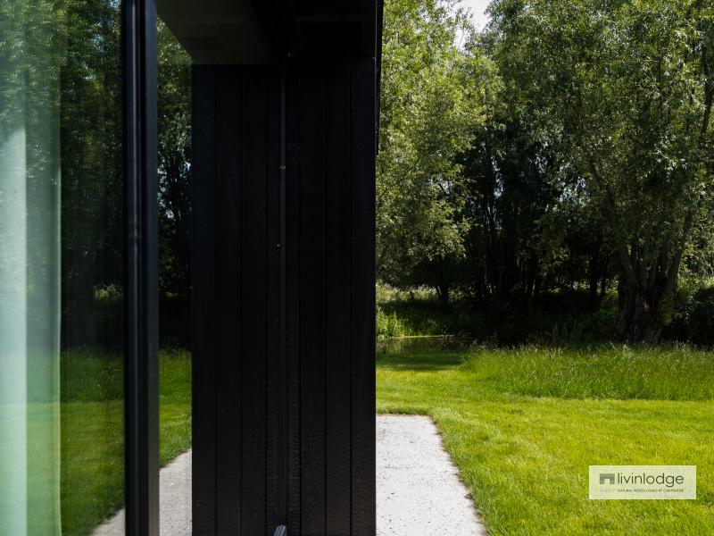 Modern timber-frame extension with panoramic view of garden