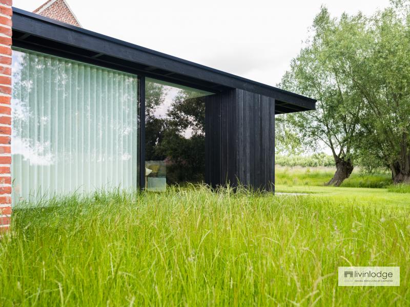 Modern timber-frame extension to traditional farmhouse