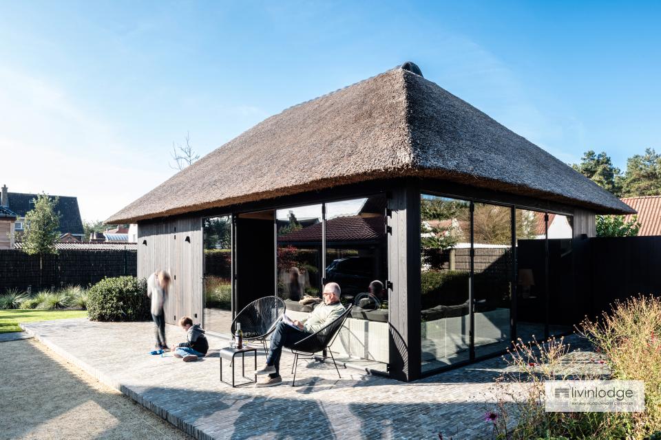 Pool house with thatched roof and thermal ash cladding, De Haan