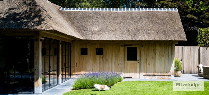 Oak pool house with tatched roof